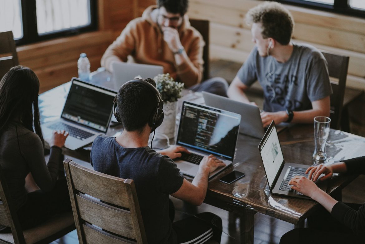 annie-spratt-QckxruozjRg-unsplash Team in an office working on laptops