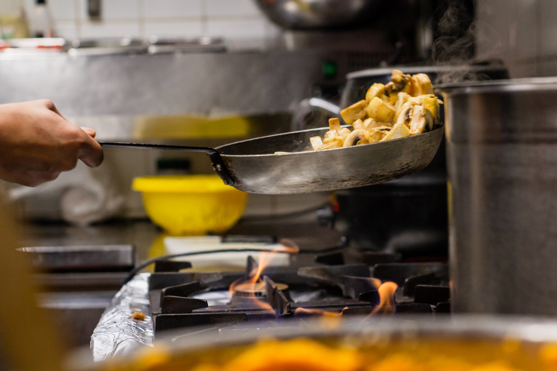 Restaurant chef cooking on stove top