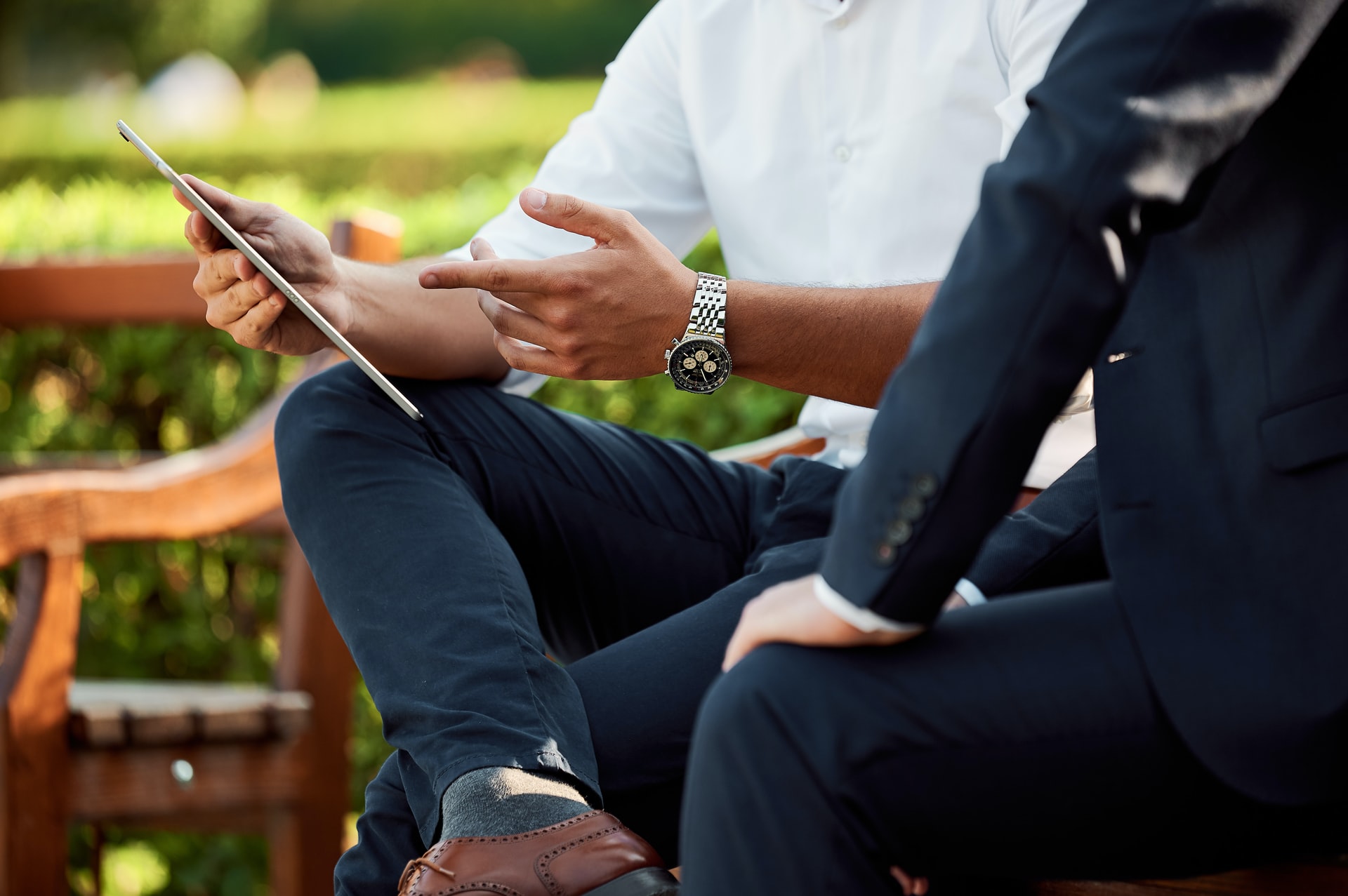 Two businessmen having a meeting in the park