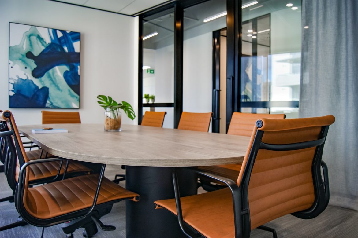s-o-c-i-a-l-c-u-t-1RT4txDDAbM-unsplash Office meeting room with chairs and a table
